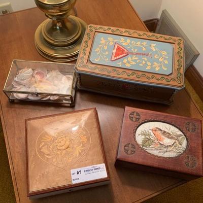 Two music boxes, a carved jewelry box with silk needlework and a glass box with seashells  