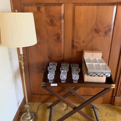 Bombay mahogany butler's tray on stand together with 3 sets of 6 crystal glasses and a brass floor lamp  