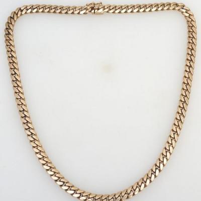 One 14kt gold solid curb link necklace. The necklace measures approx. 20.00