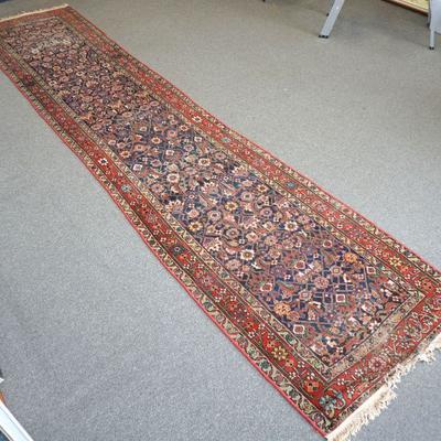Long 16 ft. Antique Persian Hosseinabad Runner. Made with all natural vegetable dye the runner corporates an all-over design on rich red...