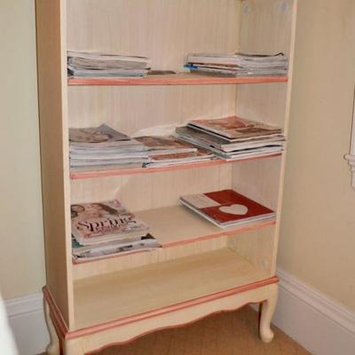 One of a pair of painted bookcases