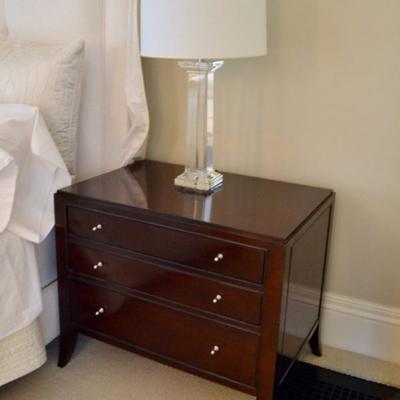 One of a pair of Baker Furniture nightstands and glass lamps