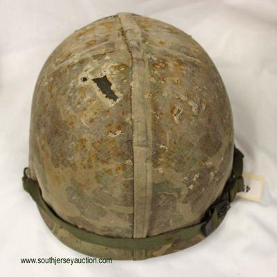  WWII m-1 Front Seam First Model Cover Helmet

Auction Estimate $300-$600 â€“ Located Inside 