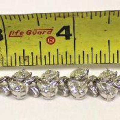  â€” GORGEOUS â€”

Platinum and 16+ ctw Diamond Bracelet [graduates approximate  (2) 3/4ct center to 1/5ct ]

approximate clarity VS-SI2...