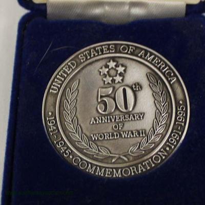  U.S. Navy Memorial Saluting Naval Veterans Commemorative Coin

Auction Estimate $20-$50 â€“ Located Inside 