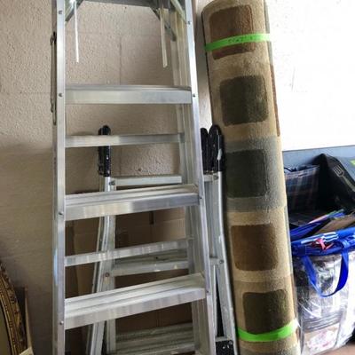 Several ladders, rugs.