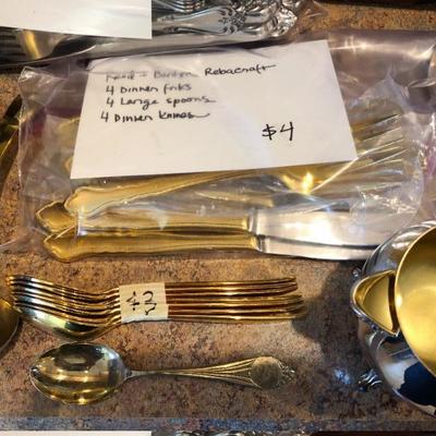 Gold flatware.