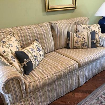 American Signature sofa w/tall back, classic pin-striping.