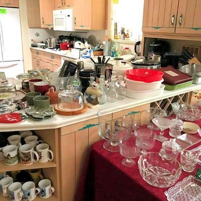Plenty of kitchen ware, small appliances, utensils, pots + pans, and more!