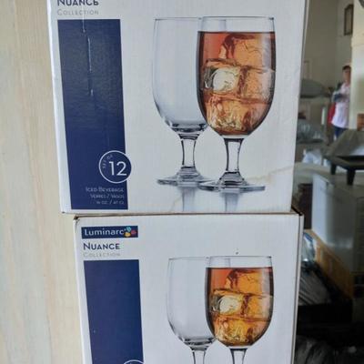 About 10 boxes of drinking glasses used once for a wedding. 