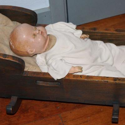Vintage Primitive Style Solid Wood Handmade Doll Cradle.  Shown with a Vintage Composition Cloth Body Baby Doll 