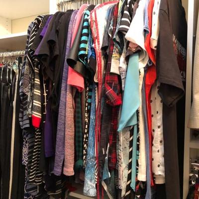 A large closet full of quality women's clothing.