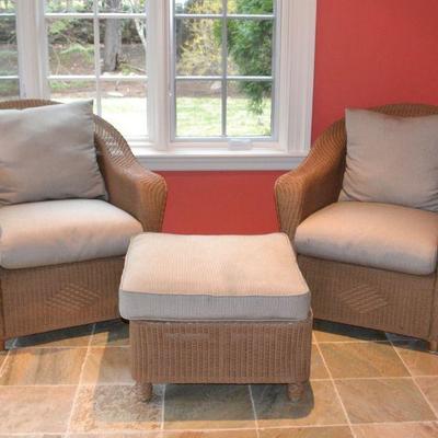 Pair of wicker armchairs and matching ottoman