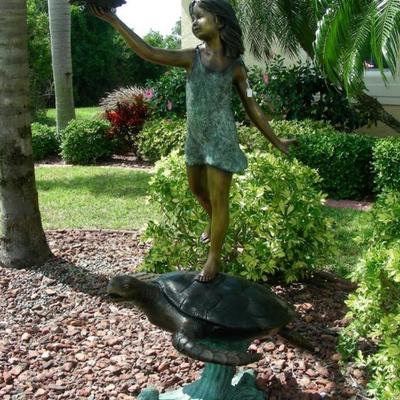 Bronze sculpture/fountain of young girl standing on turtle