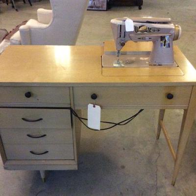 singer sewing machine in cabinet