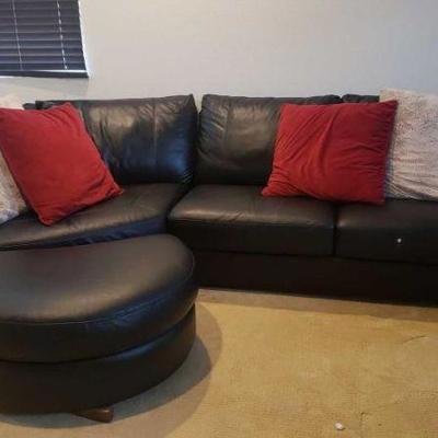 #215: Two Piece Leather Couch with Ottoman
Measures approx 10.5ft wide