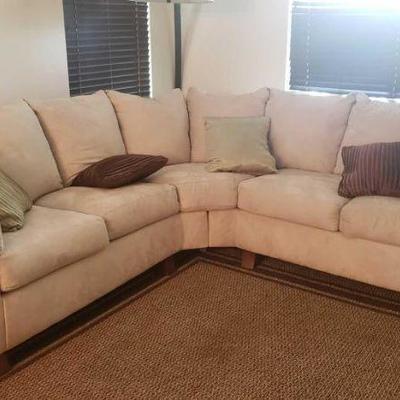 #200: 2 Piece Creme Suede Sectional Couch
Measures approx 12 ft wide