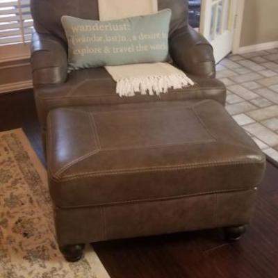 Leather chair with ottoman. Ashley furniture