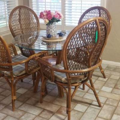 Table and 4 chairs with padded seats.
 Can be easily re upholstered with different color.