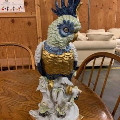 #1123: Beautiful hand-painted placed Artistiche porcelain large parrot
Measures 19 inches tall hand painted with beautiful blue and gold...