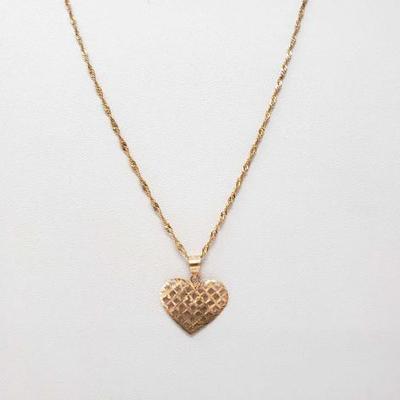 #175: 14K Gold Necklace With Heart Pendant 3.8g
14K gold necklace with heart-shaped pendant, approx. 3.8g
