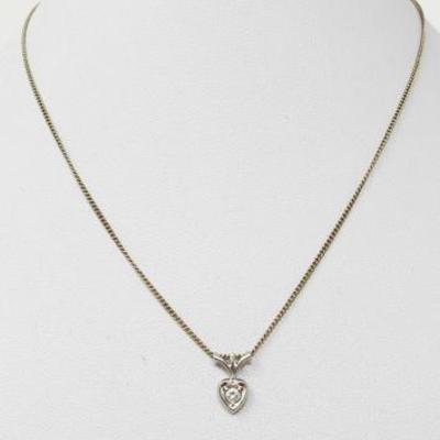 #60: 18k White Gold Diamond Pendent on a 14k Chain, 2.7g
Pendent and chain together weigh approx 2.7g, chain measures approx 15