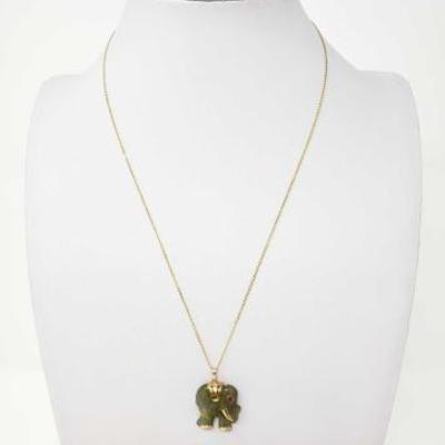 #61: 14K Gold Necklace with Elephant Pendant
14K gold chain necklace with an elephant pendant, appears to be jade. Chain weighs approx...