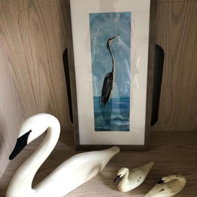 Carved swans, coastal art.