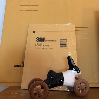 Mailing envelope, bunny on wheels