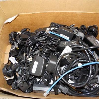 Large lot of ac adapters and chargers.