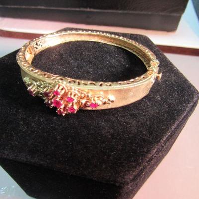 14kt gold hinged bangle bracelet with pink stones