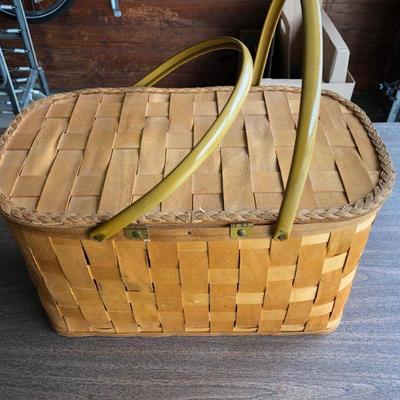 An old fashioned picnic basket with goodies inside!