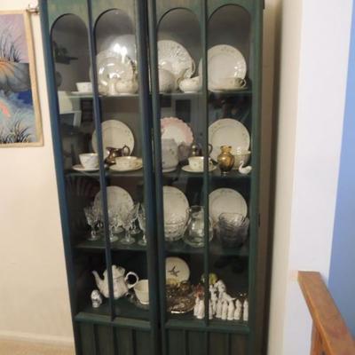 vintage china cabinet with collections