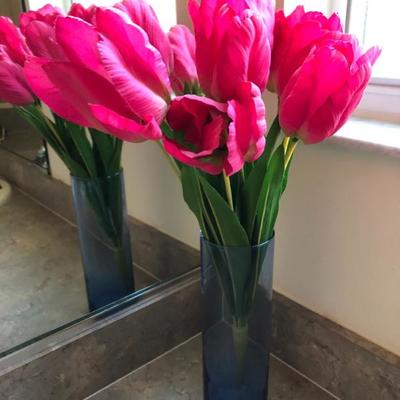 Faux tulips in glass vase