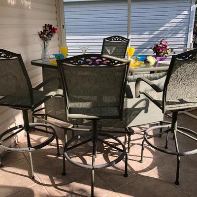	
Sage green curved metal outdoor bar with four sling swivel stools
