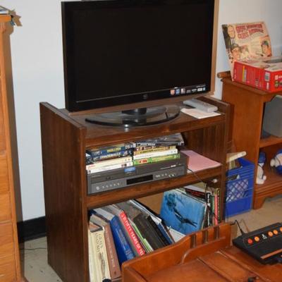 Flat Screen Television, Stand, Books, Atari Gaming Unit