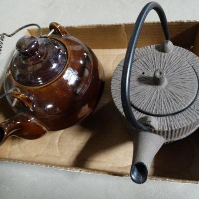Tea pot and a tea maker.
