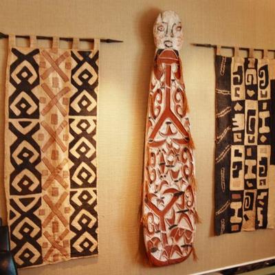 Kuba textiles and carved painted spirit board from Papua New Guinea
