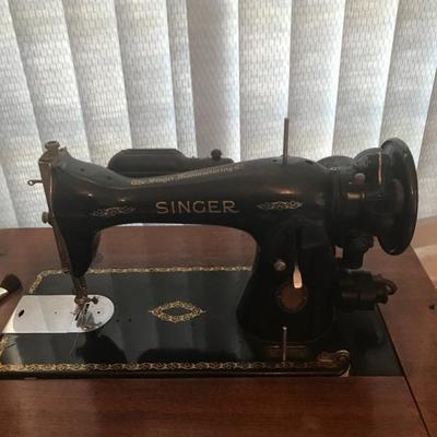 Vintage singer sewing machine with cabinet