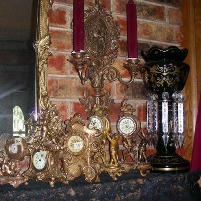 Just a few of the MANY clocks, one of a pair of one set of the lustres
