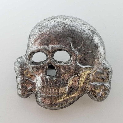 2036: 	
German World War II Waffen SS Officers Visor Cap Skull
Measures 1 3/16â€ wide by 1 3/16â€ tall. The front shows a skull and...