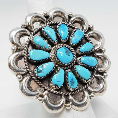 603: 	
Turquoise Cluster Sterling Silver Ring, 14.9g
Weighs approx 14.9g, size 6.5