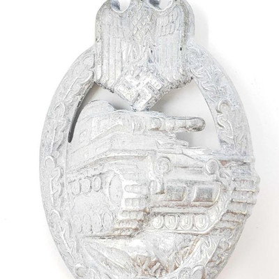 2038:	
German World War II Army Silver Tank Assault Badge
The front shows a tank in the center with a German army eagle at the top. Both...