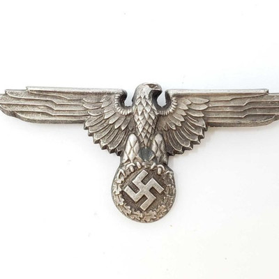 2030: 	
German World War II Waffen SS Officers Visor Cap Eagle
The front shows a Waffen SS eagle clutching a swastika in his talons....