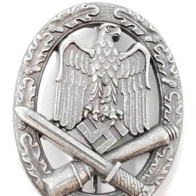 2016:German World War II Army Silver General Assault Badge
The front shows a German eagle clutching a swastika with a cross grenade and...