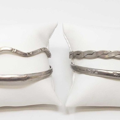 825:  	
Four Sterling Silver Bracelets, 63.6g
All four combined weigh approx 63.6g 
5
