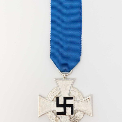 2073: German World War II NSDAP 25 Year Faithful Service Cross
Includes the issue blue ribbon. Nickel construction with a black enameled...