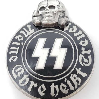2041: German World War II Waffen SS Schutz Staffel Membership Badge
Measures 1 1/8â€ wide by 1 5/16â€ tall. The front reads â€˜Meine...
