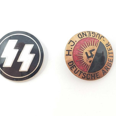 2055: 	
Two German World War II Enameled Party Pins
They measure approximately 7/8â€ in diameter. The first one is a pair of Waffen SS...