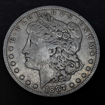 853: 	
1887 Morgan Silver Dollar, New Orleans Mint
1887 Morgan Silver Dollar, New Orleans Mint